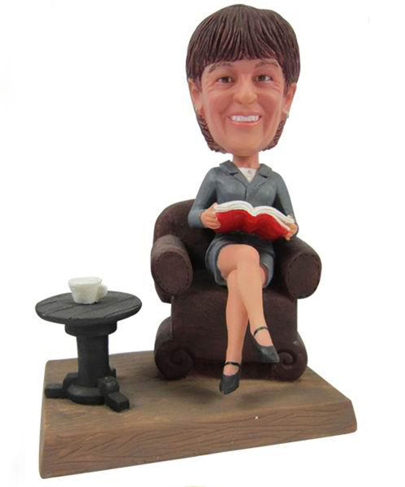 Intelligence bobblehead sitting on a chair 