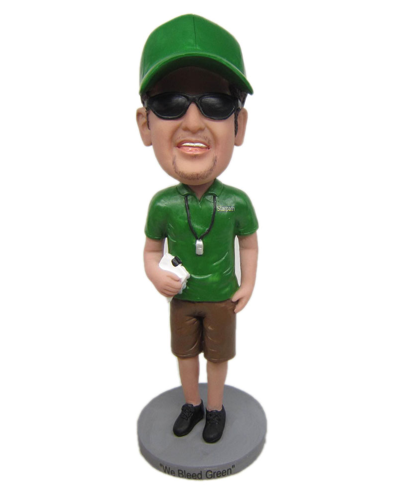 bobblehead coach with green shirt and blown pants