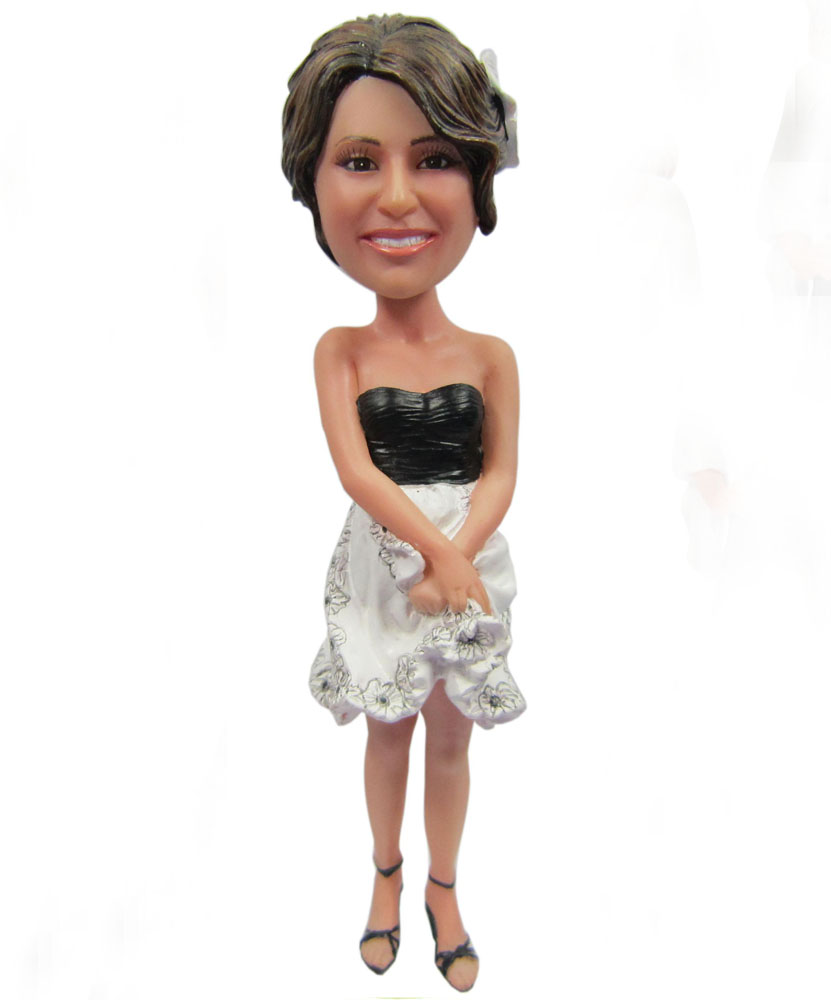 Collectible bobbleheads of wedding dress