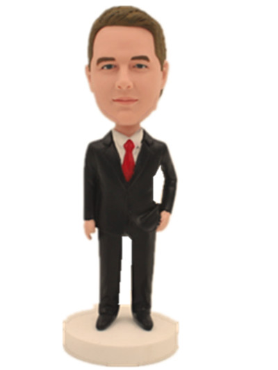 male in black suit on hand in pocket bobblehead
