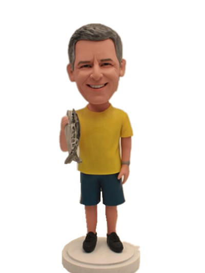 man dolding a fish custom bobblehead doll