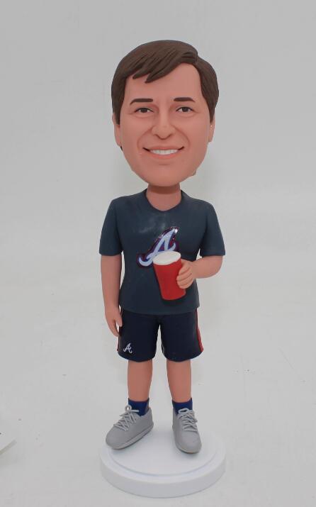 Casual man  with a cup of coffee bobble head doll