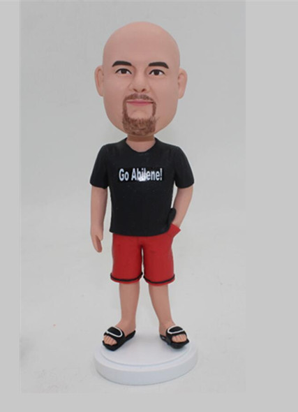 Man in black tshirt and red shorts and slipper casual man bobble head