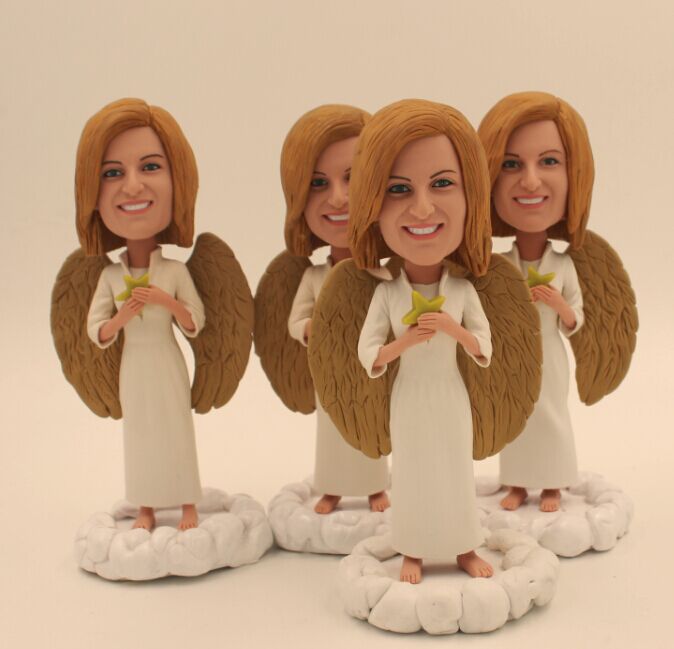 Four custom bobblehead angels