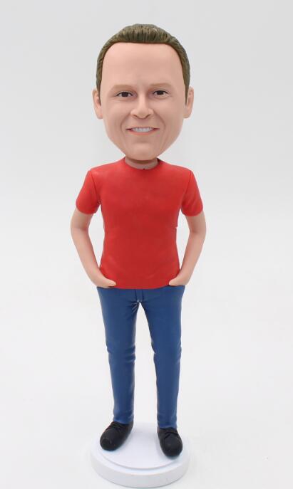 Casual man in red tshirt and jeans hands in pockets bobblehead