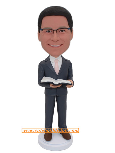Gift For Male Teacher Custom Bobblehead Man In Grey Suit And Light Pink Tie With A Book On Hands