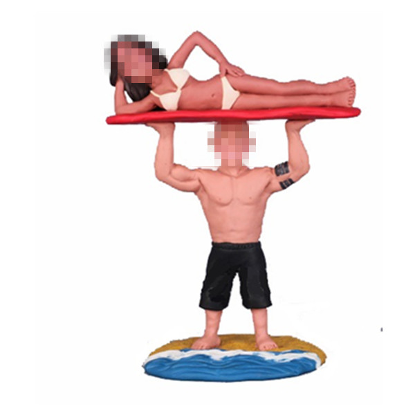 custom couple bobble head doll male holding female on beach