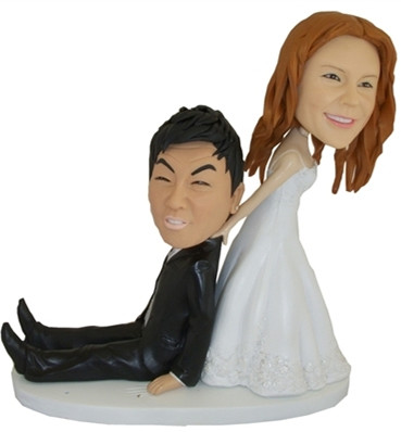 custom bobbleheads cake toppers bride dragging the groom