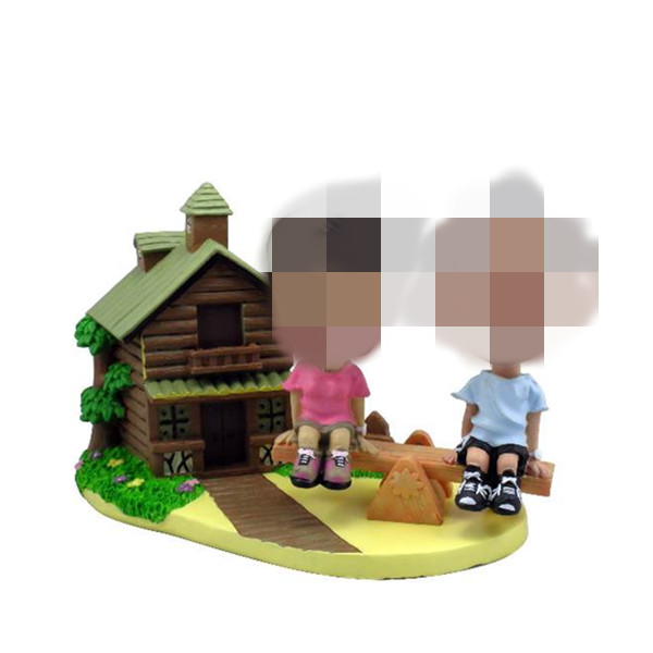 Bobblehead Couplen sitting in front of the house
