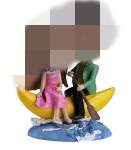 couple bobble head sitting on the banana boat