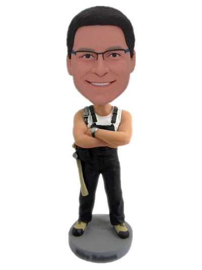 Dashboard bobble heads repairman with black suspenders