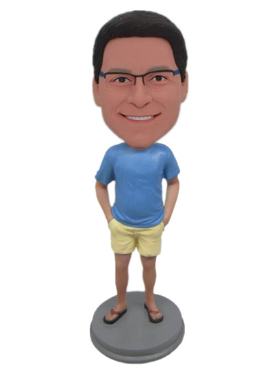 Personal bobbleheads  dressed in blue tshirt and yellow shorts and flip flops