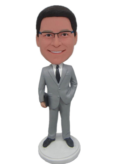 Custom made figurines business man dressed in gray suit with a briefcase