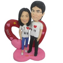 Custom bobble head wedding cake topper