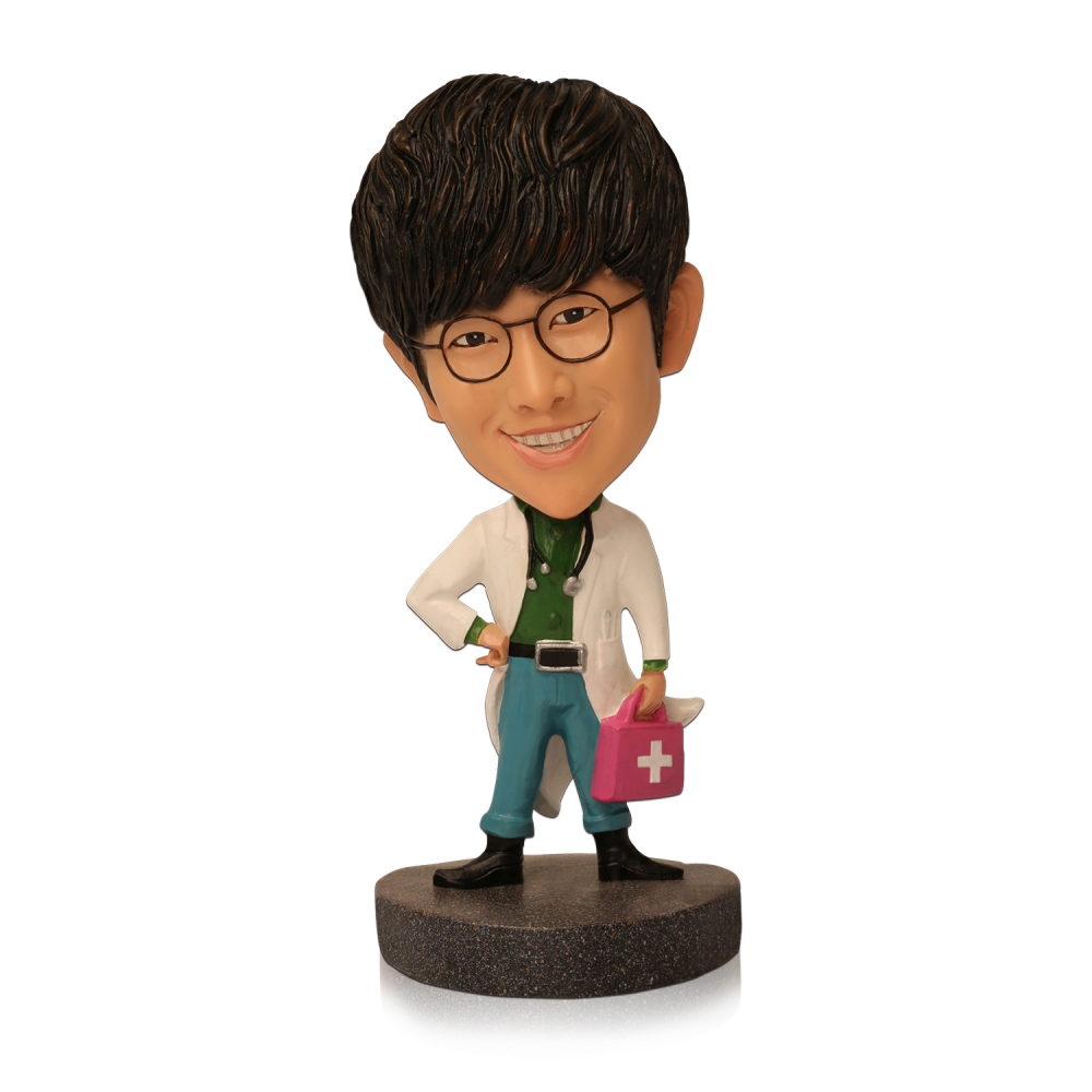 doctor bobble head with a medical box