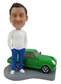 Man with his car bobble head creat