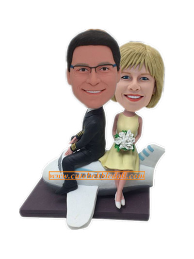 Couple Custom Bobblehead Sitting On Plane