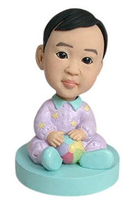 custom baby bobble head playing with a ball