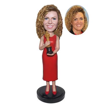 Custom Awards bobblehead holding a Trophy